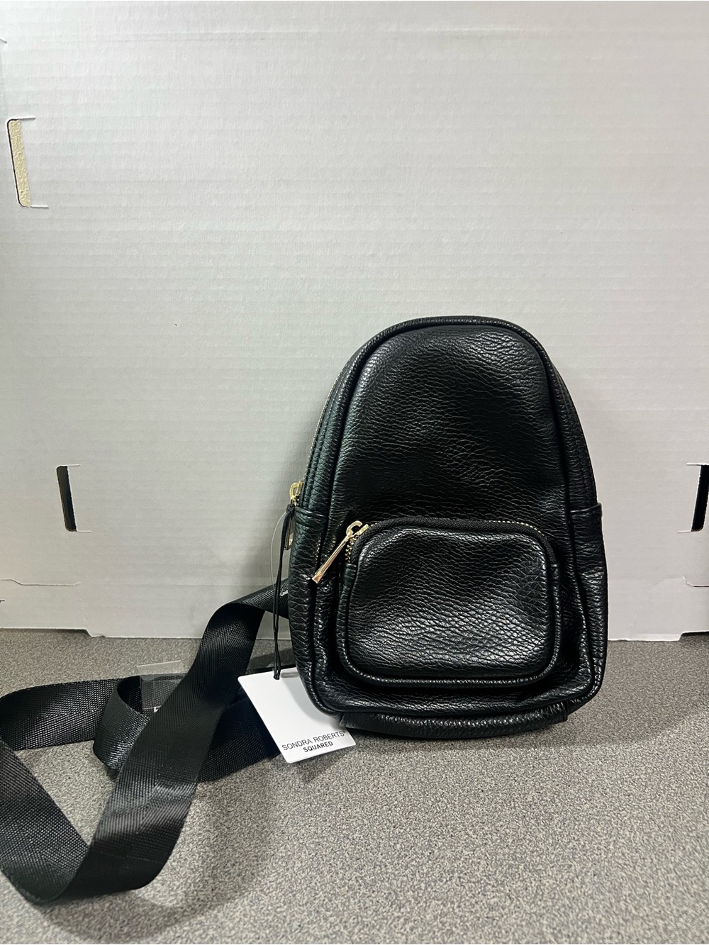 Sondra Roberts Black Faux Leather Compact Crossbody sling bag with Gold Zipper